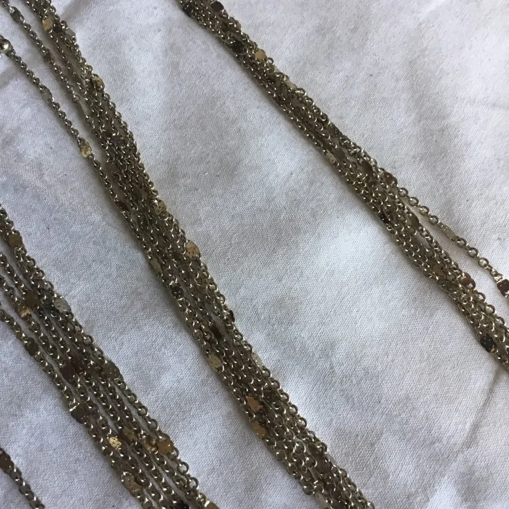 $12 or 3/$25. 5 Strand Goldtone Necklace